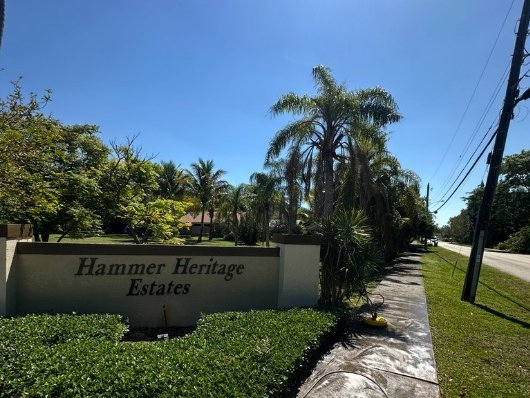 Before HOA entrance sign and sidewalk pressure washing in South Florida