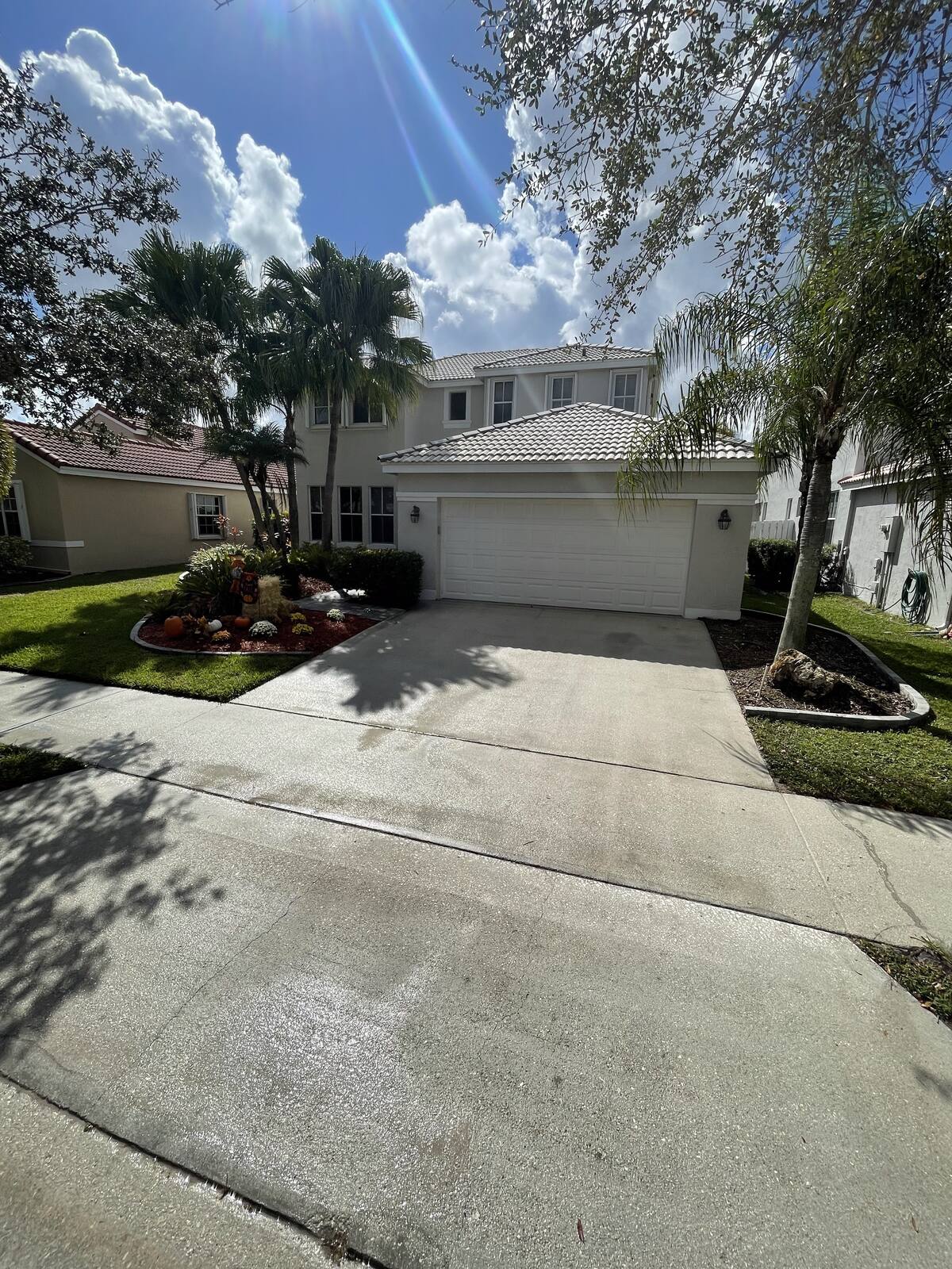 Concrete driveway pressure washing in South Florida — after