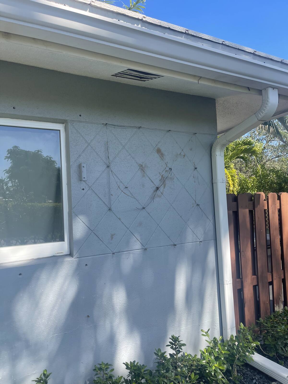 Dirty house exterior wall in South Florida — before