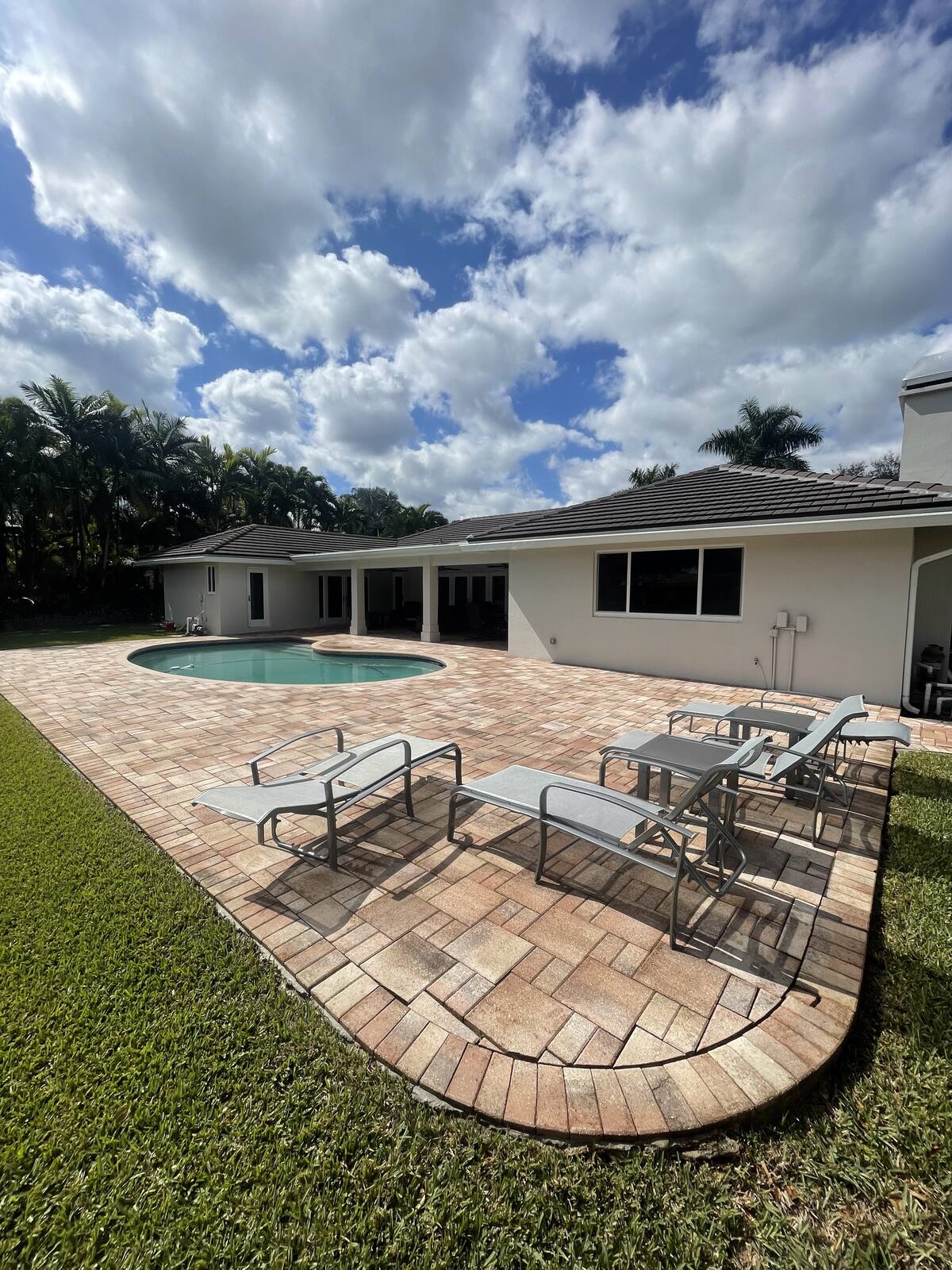 Paver pool deck cleaning in South Florida — after