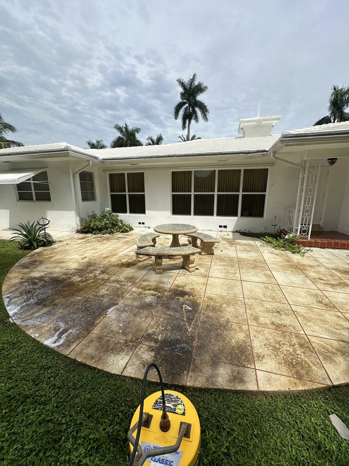 Stamped patio cleaning in Pembroke Pines, FL — before