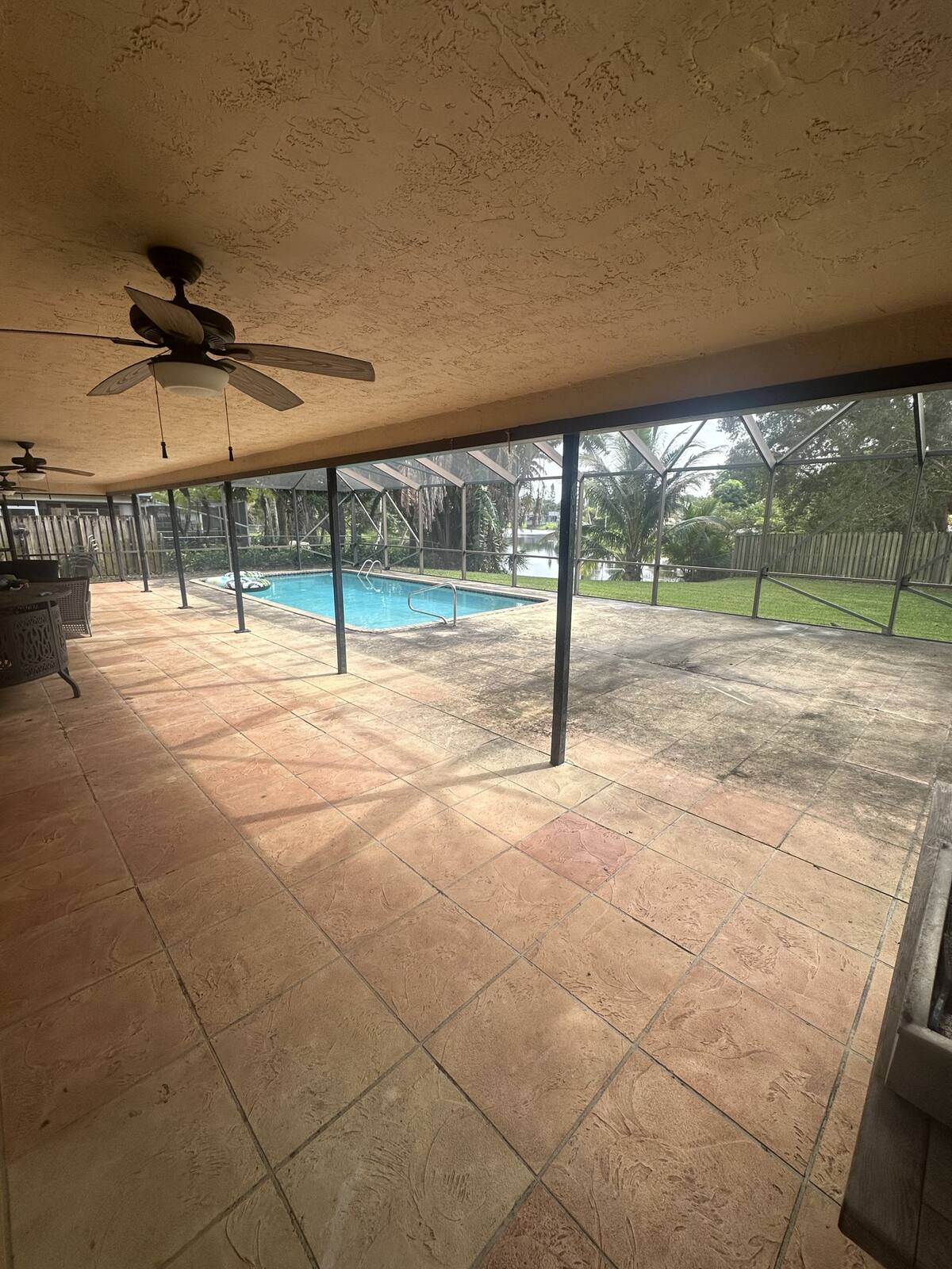 Screened lanai and patio cleaning in Plantation, FL — before