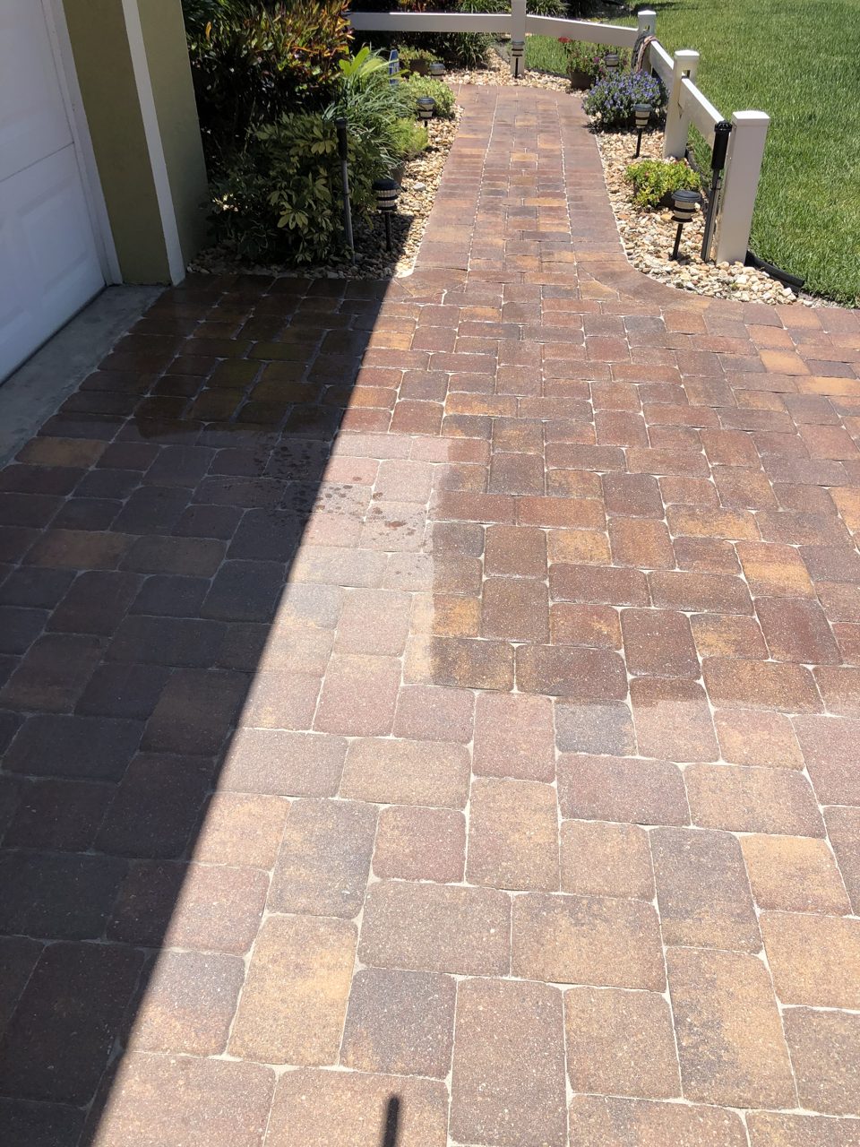 Sealed paver walkway with rich, restored color at a South Florida home