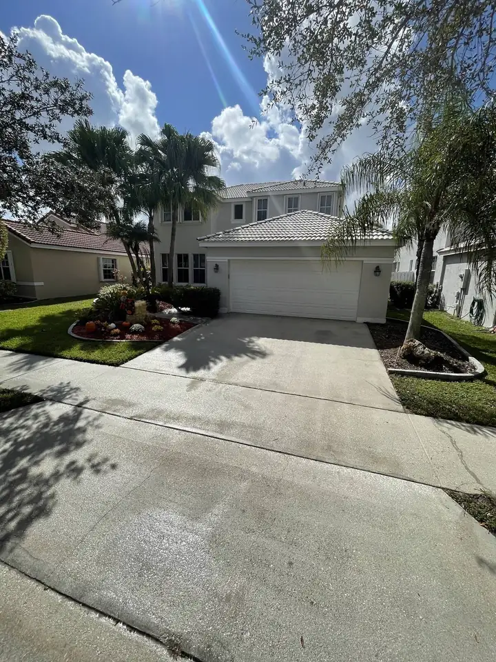 Concrete driveway pressure washing in South Florida — after