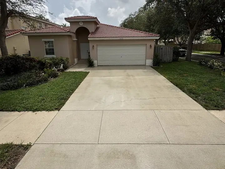 Concrete driveway in South Florida after pressure washing — after
