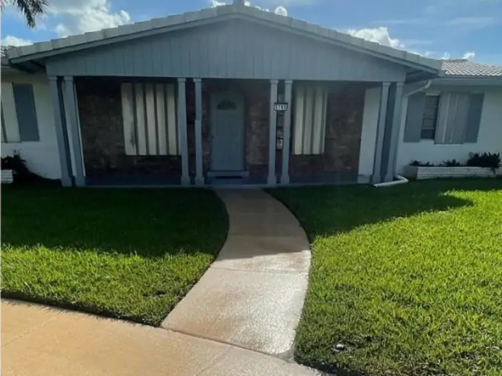 South Florida home exterior and walkway after house washing — after
