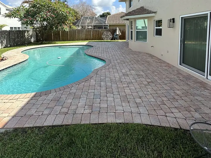Paver pool deck in South Florida after pressure washing — after
