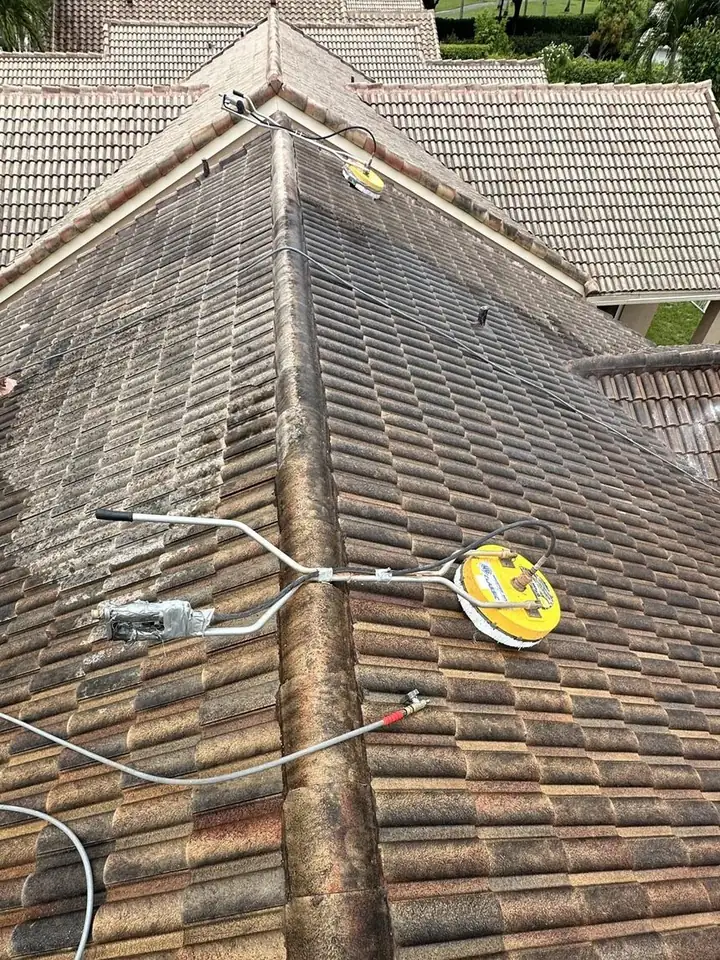 Dirty barrel-tile roof before cleaning in Weston, FL
