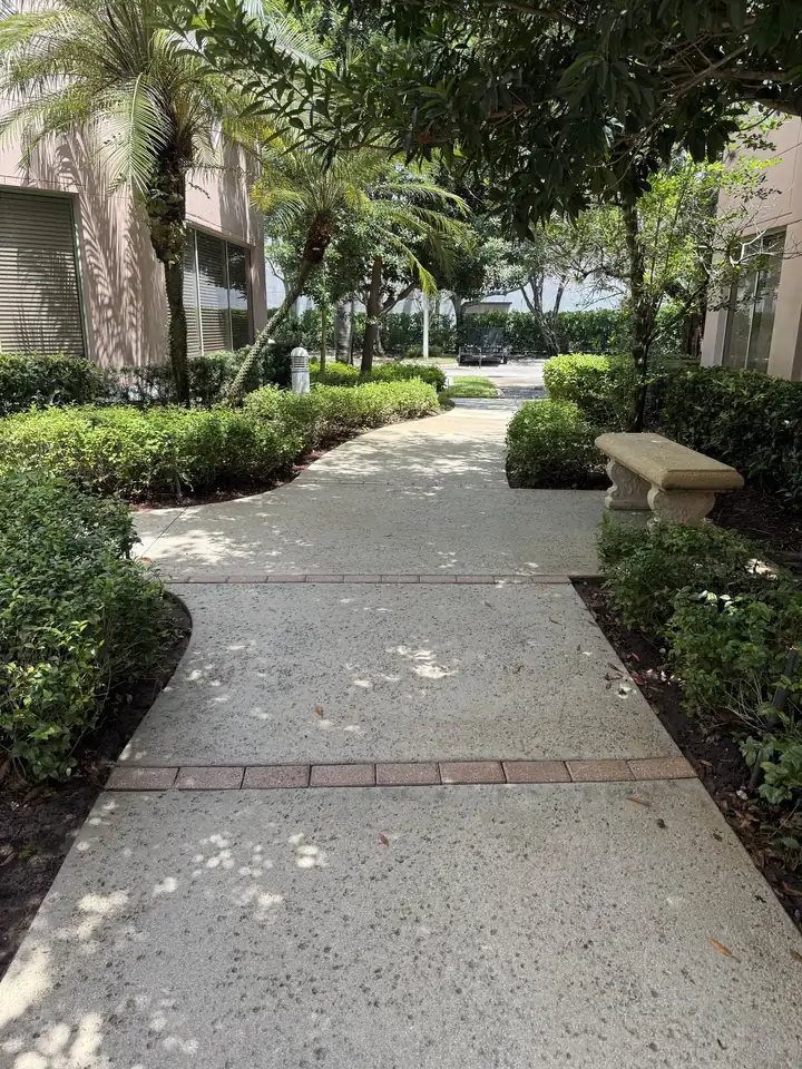 After pressure cleaning a commercial walkway in Weston, FL &mdash; concrete and keystone borders