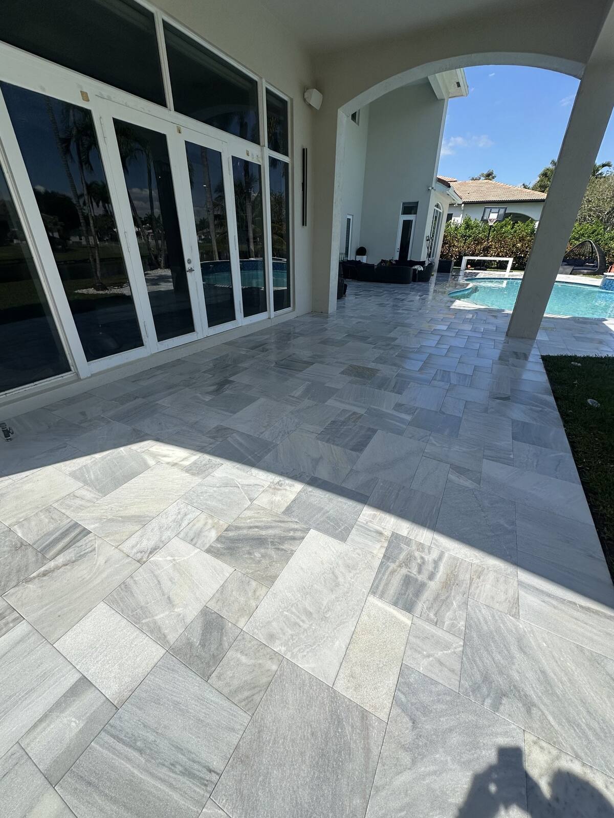 Marble pool deck after pressure cleaning in Weston, FL — clean