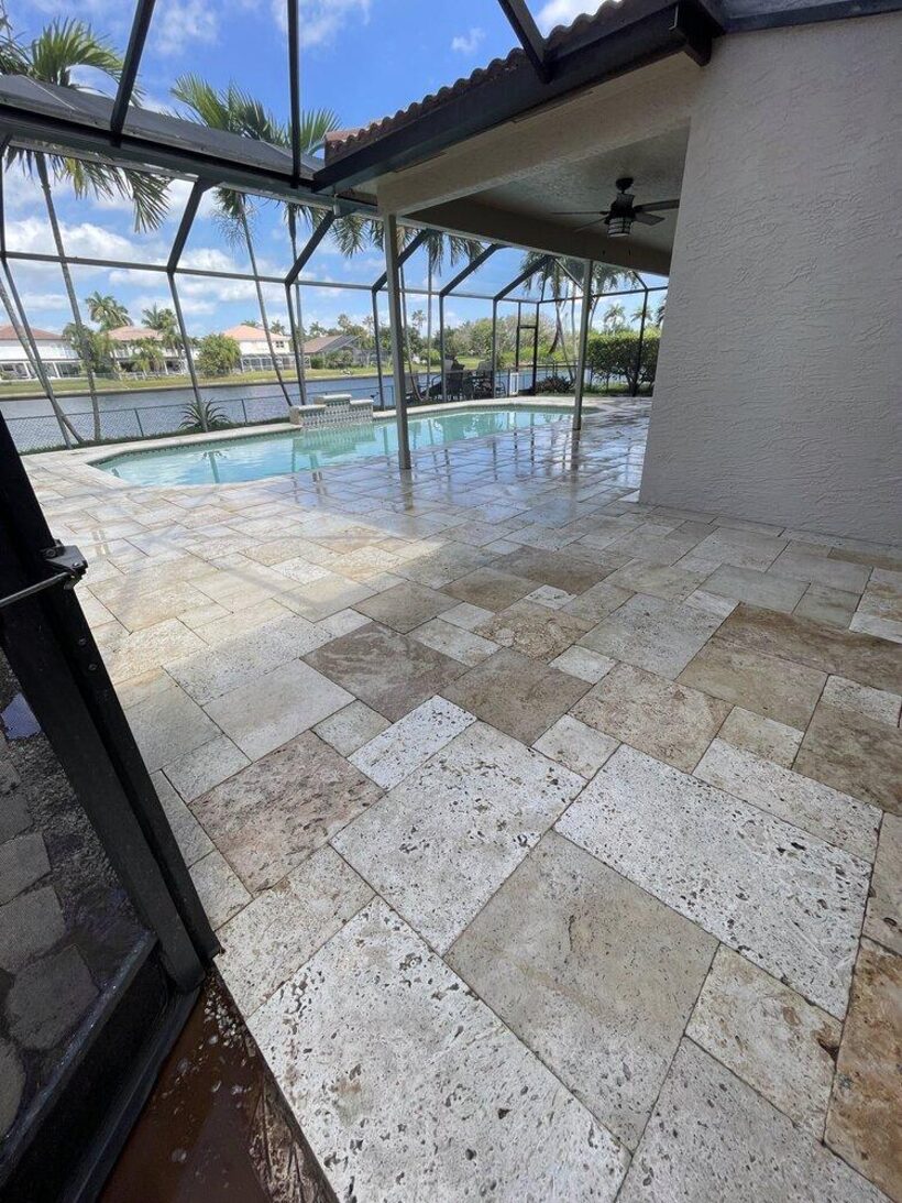 Travertine pool deck after pressure cleaning in Weston, FL — clean