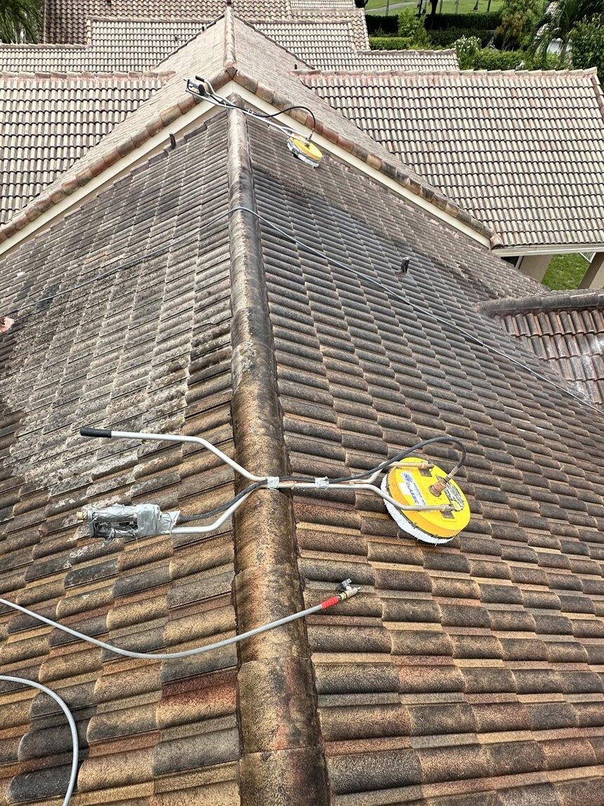 Dirty barrel-tile roof before cleaning in Weston, FL